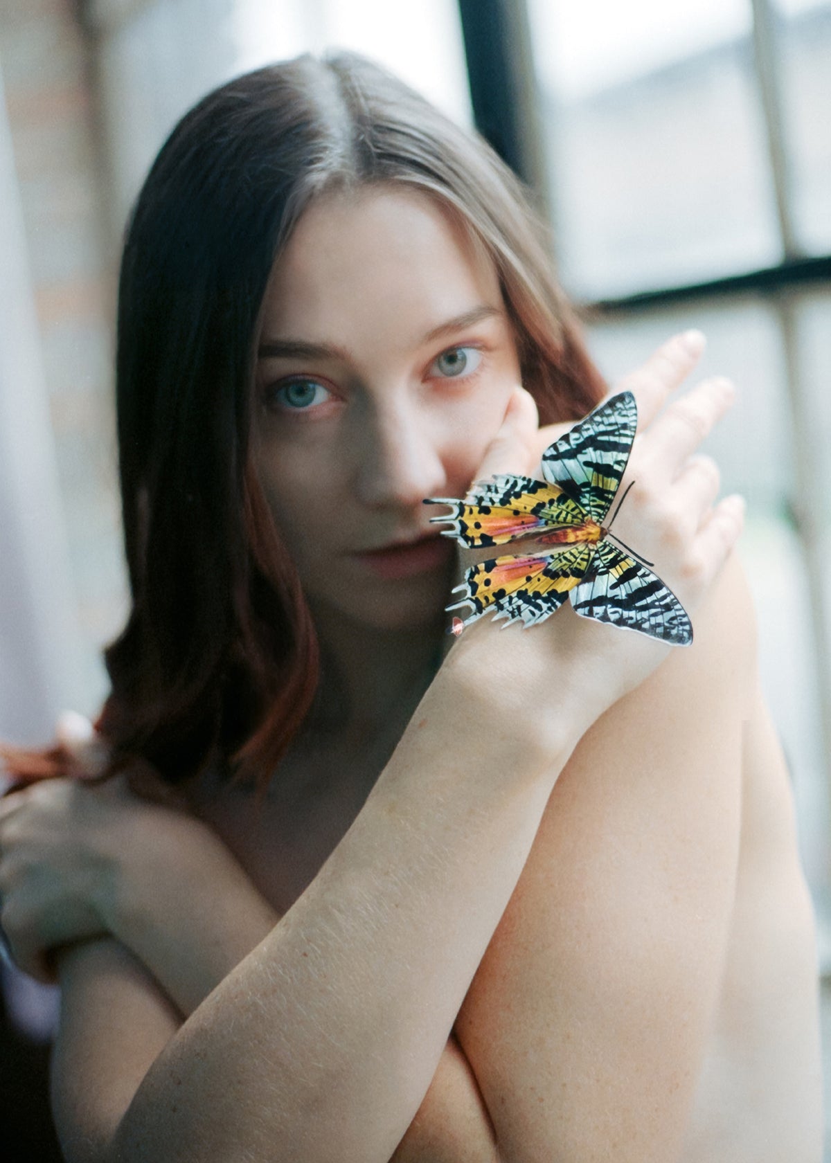 Woman  with butterfly on hand